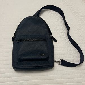 Michael Kors logo sling pack.